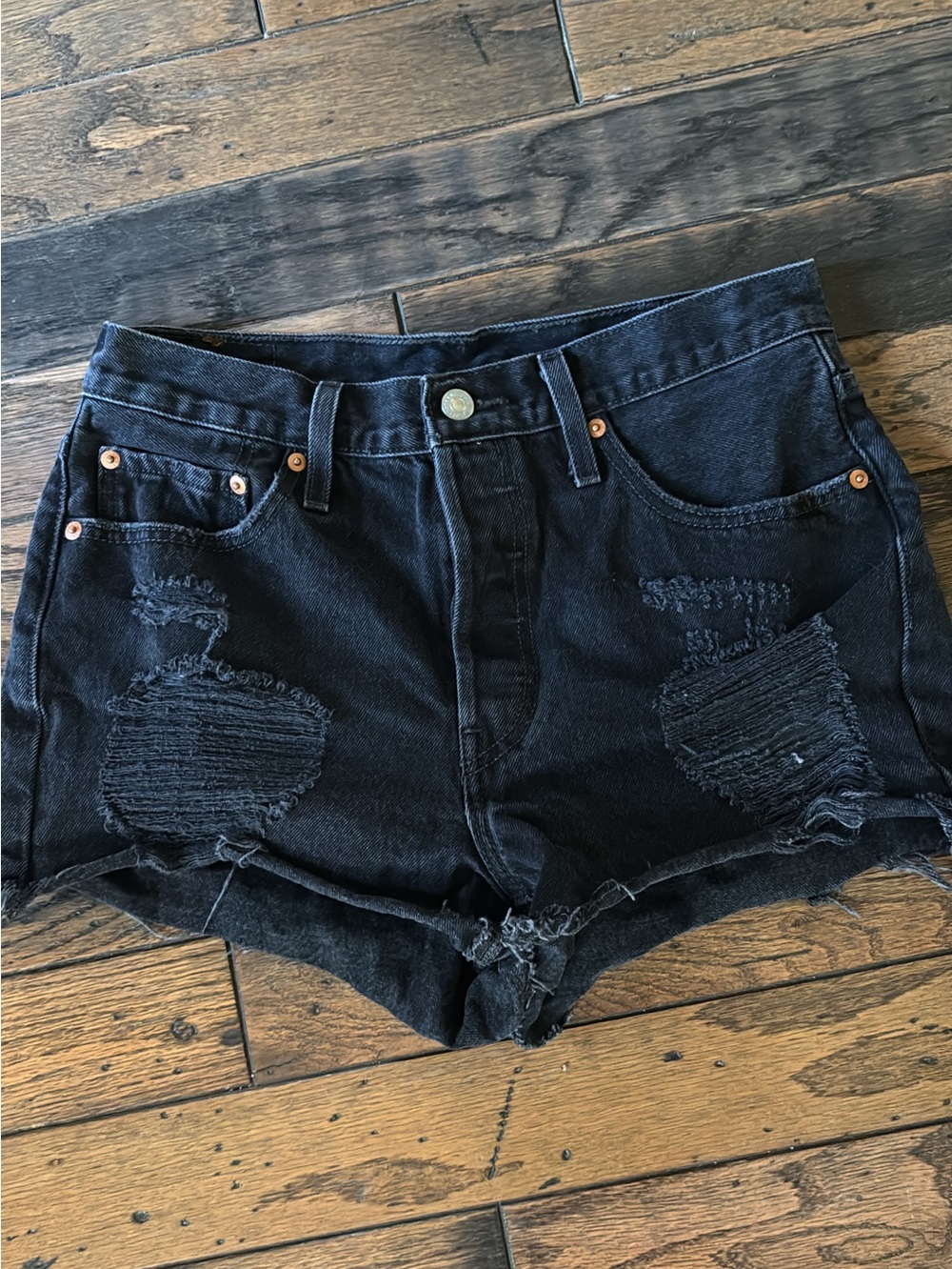 Black Distressed Women's Levi’s Denim Shorts Buttonfly Closure.
